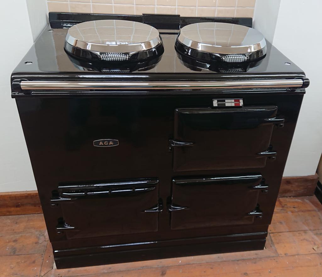 <p>2 Oven Aga cooker fully refubished and enamelled in Black